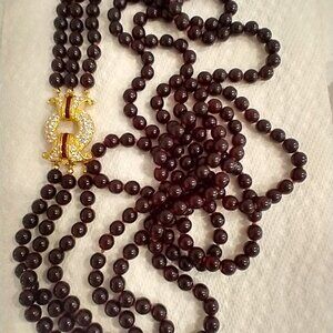 Nolan Miller triple strand necklace Garnet colored beads 31"